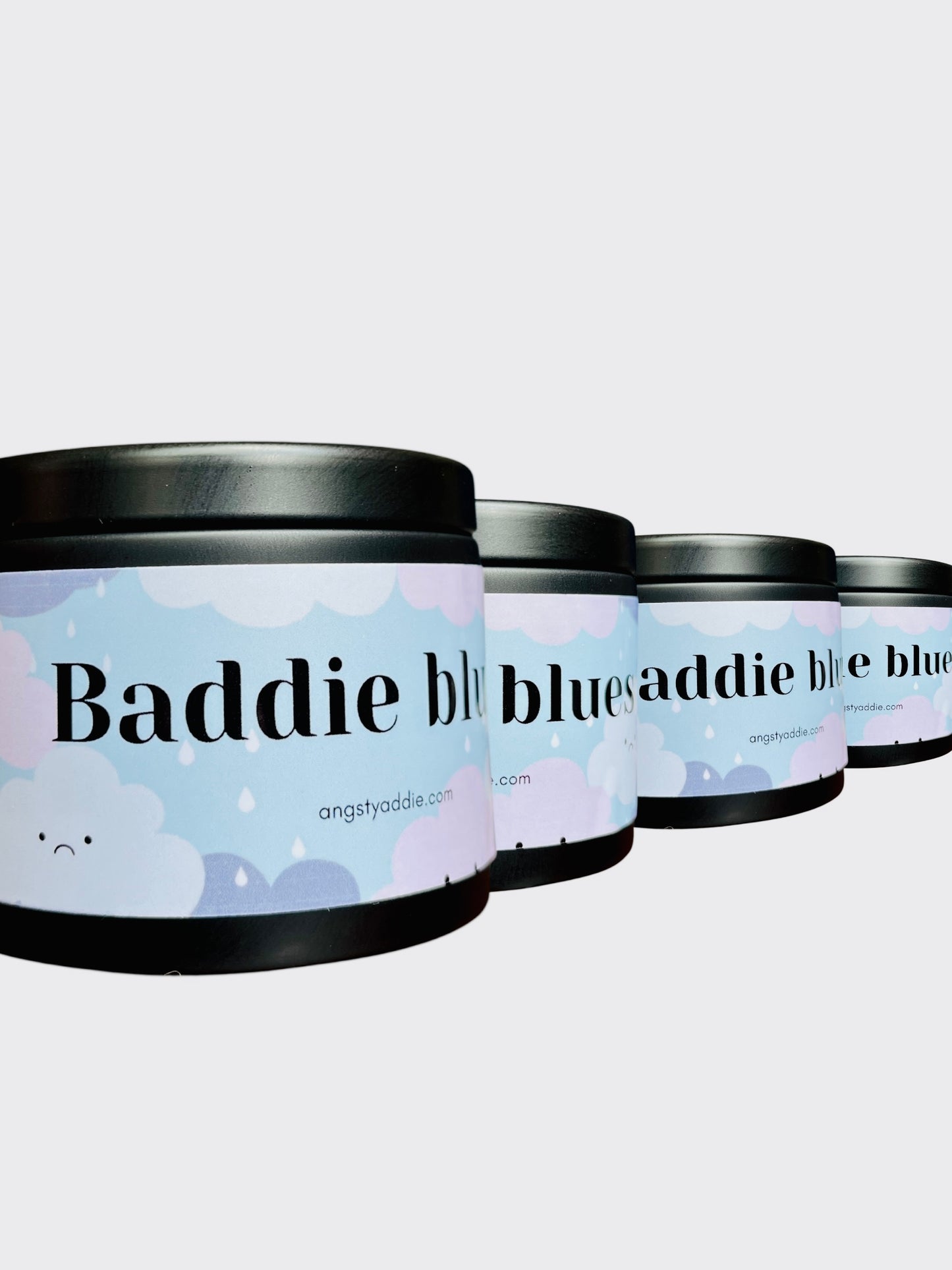 three cylindrical containers with a cloud design on the labels, arranged in a row.