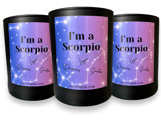 Three black "I'm a Scorpio" candles with purple constellation-themed labels