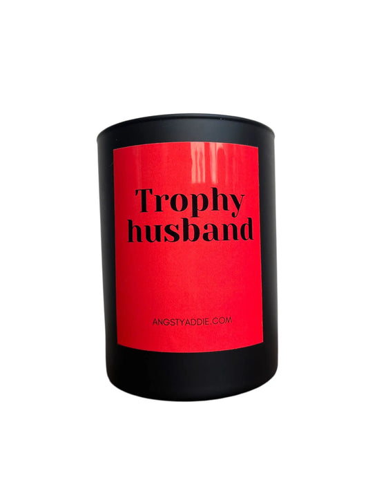 Black container with a red label that reads 'Trophy husband'.