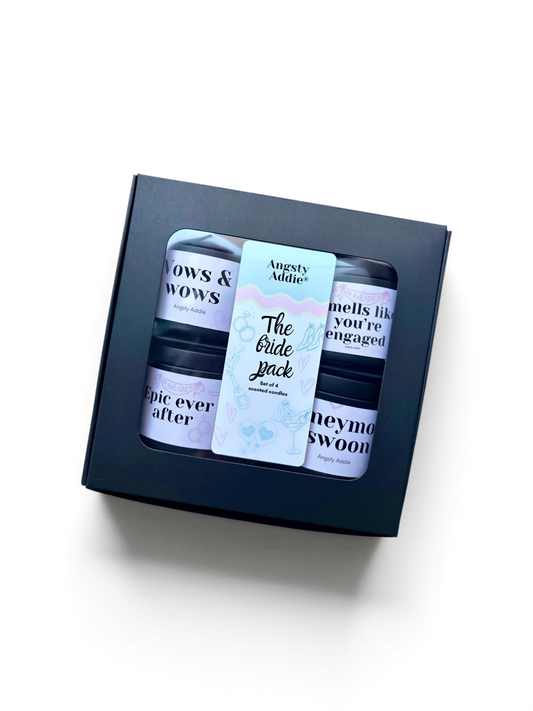 A black box containing three small jars with text on them, placed on a white background.