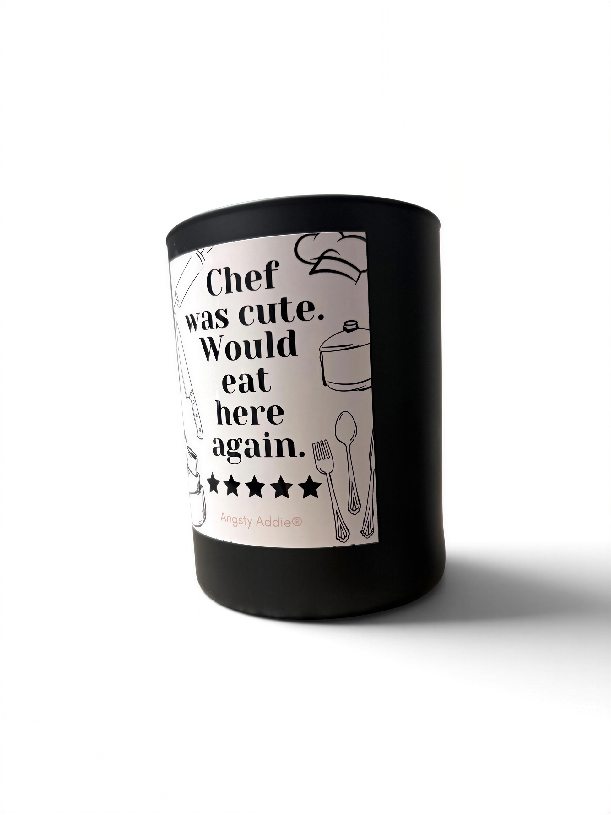 A black cylindrical container with a white label that contains text and illustrations of kitchen utensils.