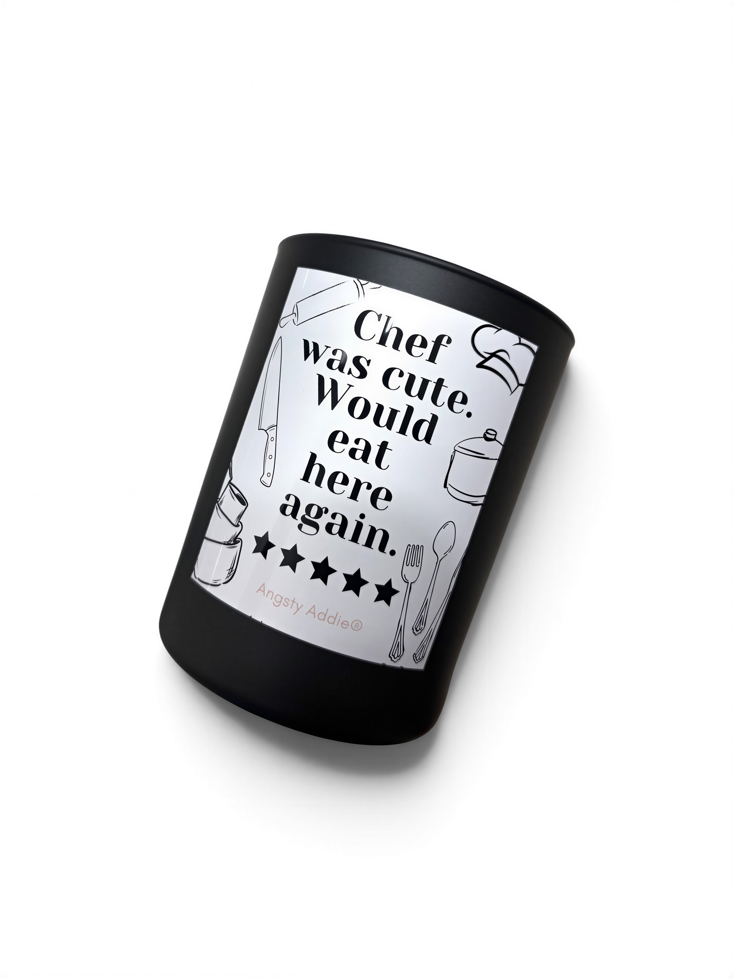 A black cylindrical container with a white label featuring a humorous text and illustrations related to cooking and food.