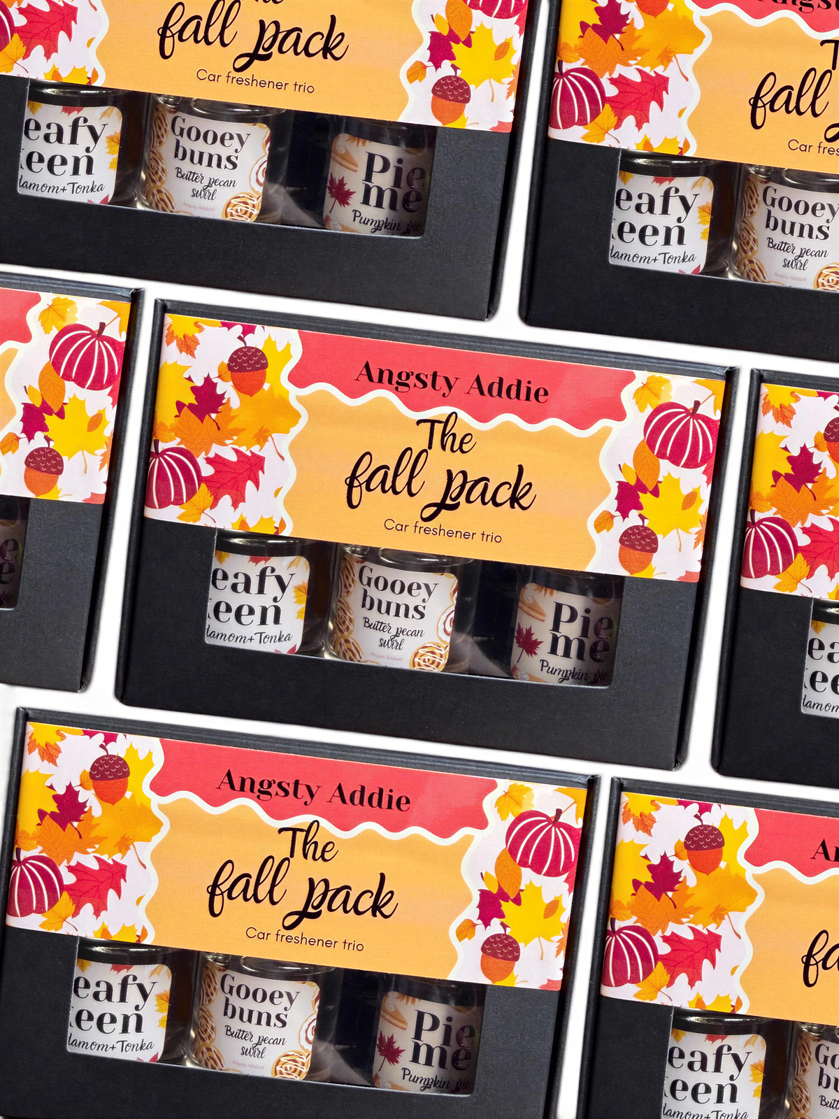 a collection of fall-themed items, including a car freshener trio and three mugs, all with autumn designs.